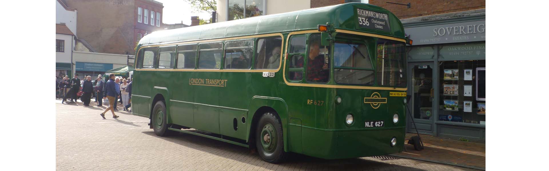 Green London Transport bus on Chesham Broadway displaying a destination of Rickmansworth