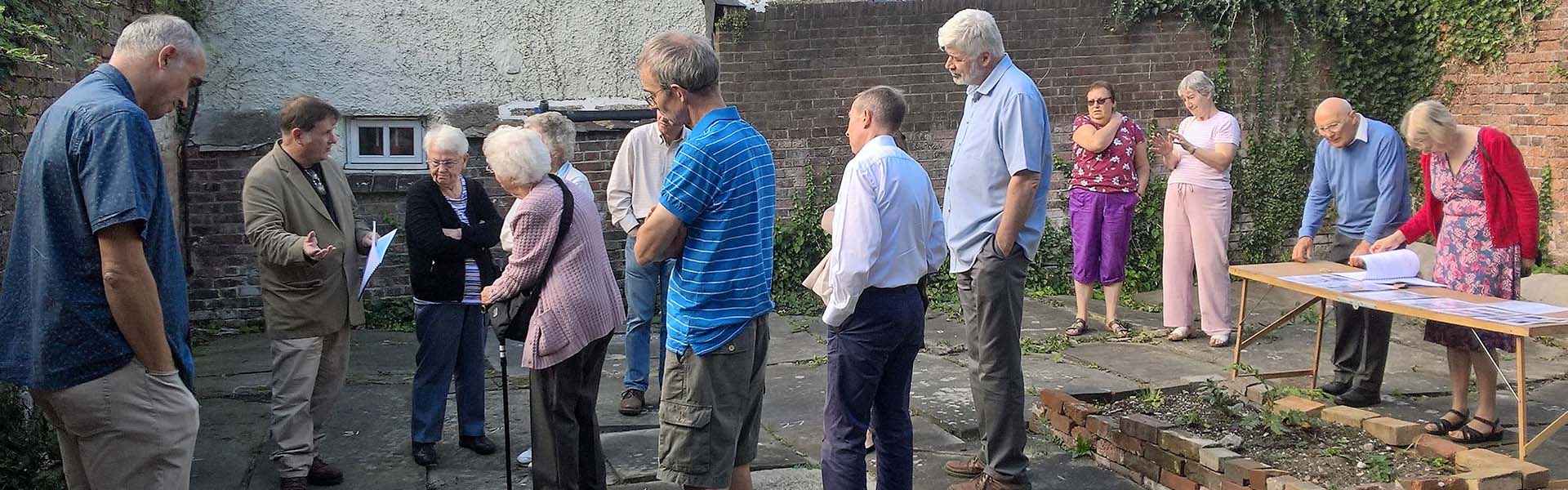 People gathered listening to a talk